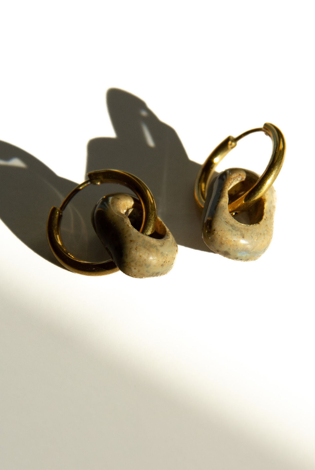 Azoia handmade ceramic earrings in Beige — subtle small hoop, everyday elegance, made in Lisbon Portugal by Jadeo Studio, silver and gold hoop