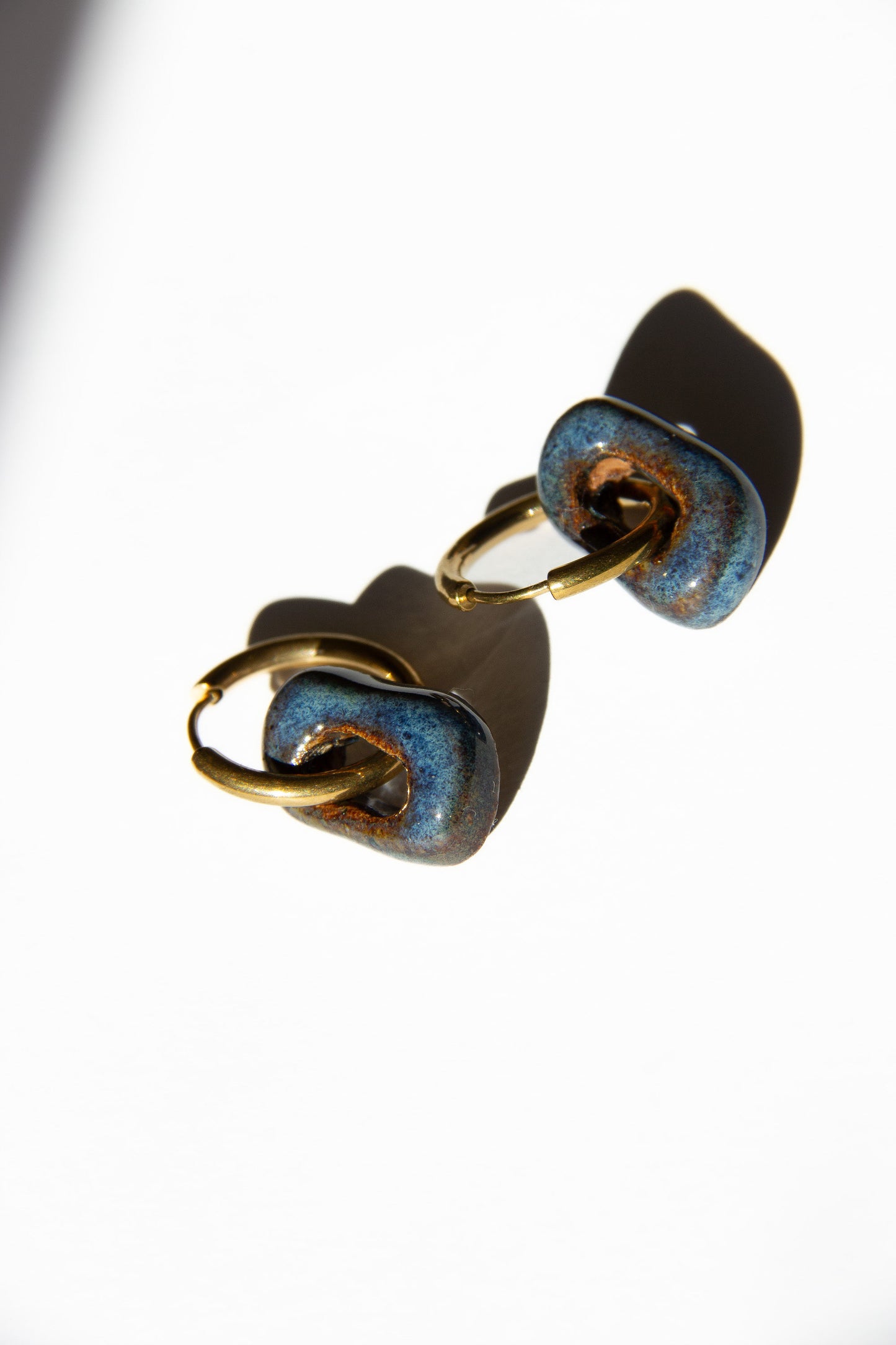 Azoia handmade ceramic earrings in Blue Jeans — subtle small hoop, everyday elegance, made in Lisbon Portugal by Jadeo Studio, silver and gold hoop