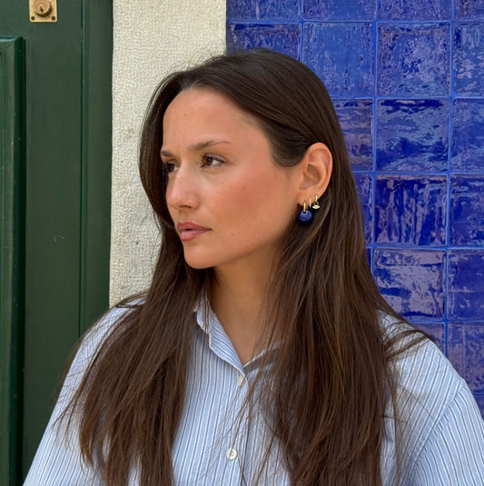 Gomes handmade ceramic earrings in Blue Navy on a blue navy azulejos background — rounded circular form, bold yet discreet, made in Lisbon Portugal by Jadeo Studio