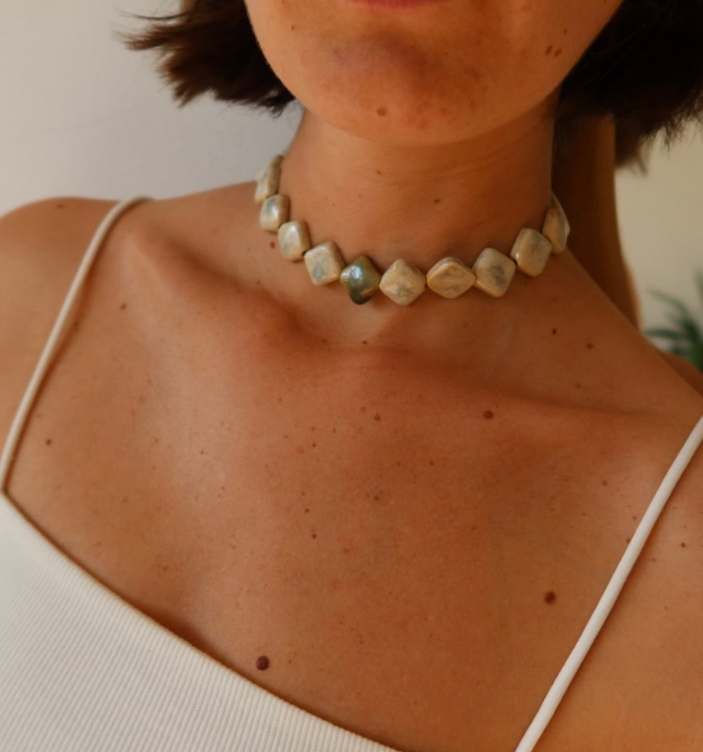 Monti handmade ceramic choker necklace in Sparkling White and Light Green, summer lifestyle — sculptural beads inspired by Roman architecture, made in Lisbon Portugal by Jadeo Studio