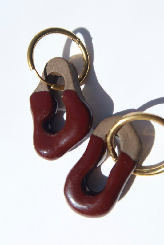 Mosca handmade ceramic earrings in Brown Red on Dark Clay — organic sculpted clay with glossy glaze, made in Lisbon Portugal by Jadeo Studio, Lisbon lifestyle