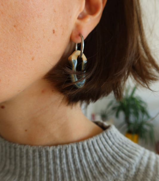 Mosca sparkling blue ceramic earrings worn — lightweight handmade design with glossy glaze, sculpted clay jewelry by Jadeo Studio Lisbon