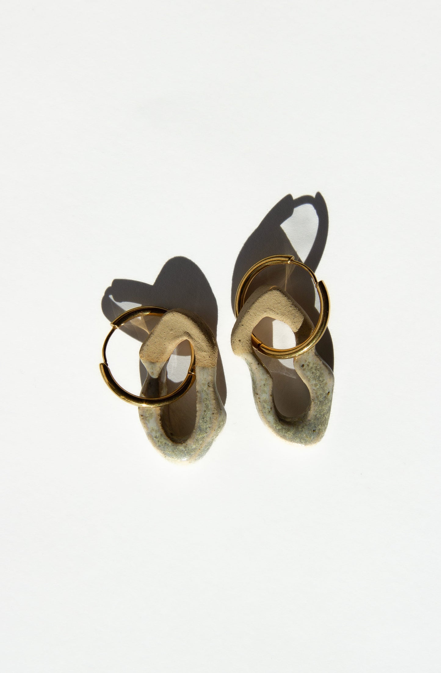 Mosca handmade ceramic earrings in Sparkling White — organic sculpted clay with glossy glaze, made in Lisbon Portugal by Jadeo Studio, silver and gold hoop