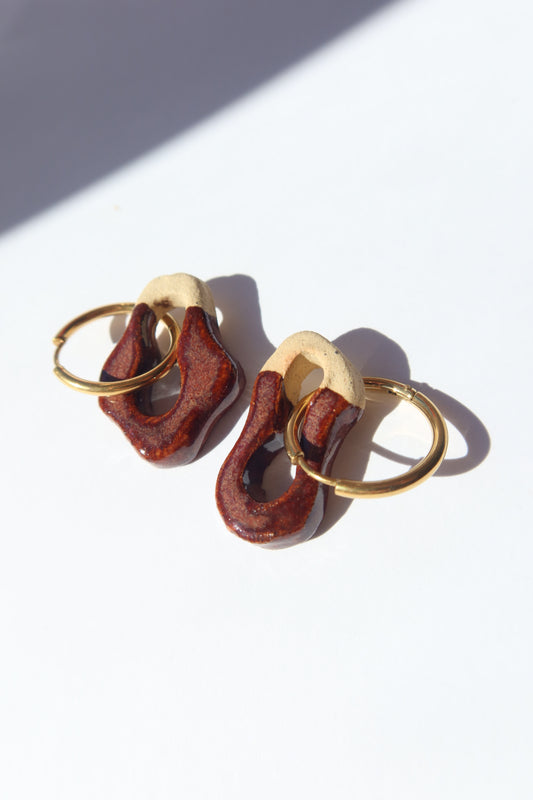 Mosca burgundy ceramic earrings handmade in Lisbon — organic sculpted clay with glossy finish by Jadeo Studio