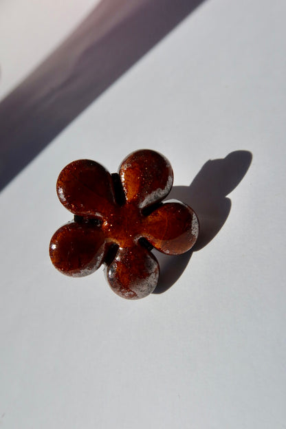 Bloom ceramic flower ring in deep bark amber glaze with copper shimmer, handmade in Lisbon