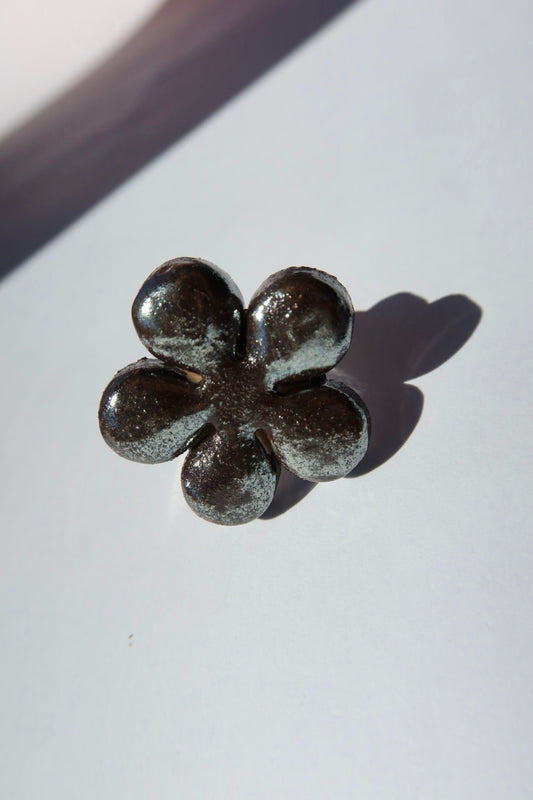 Bloom ceramic flower ring in deep silver iridescent glaze, handmade in Lisbon