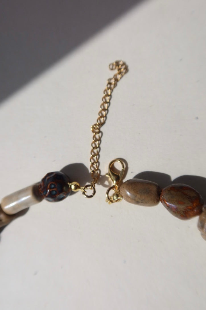Achado ceramic bead necklace gold clasp detail — Maré Collection, handmade in Lisbon by Jadeo Studio