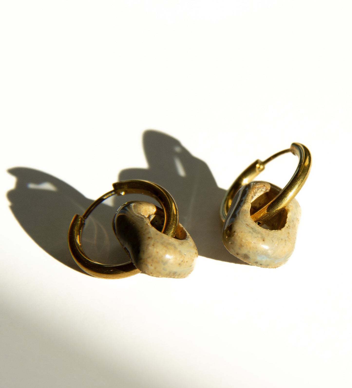 Azoia handmade ceramic earrings in Beige — subtle small hoop, everyday elegance, statement jewelry made in Lisbon Portugal by Jadeo Studio