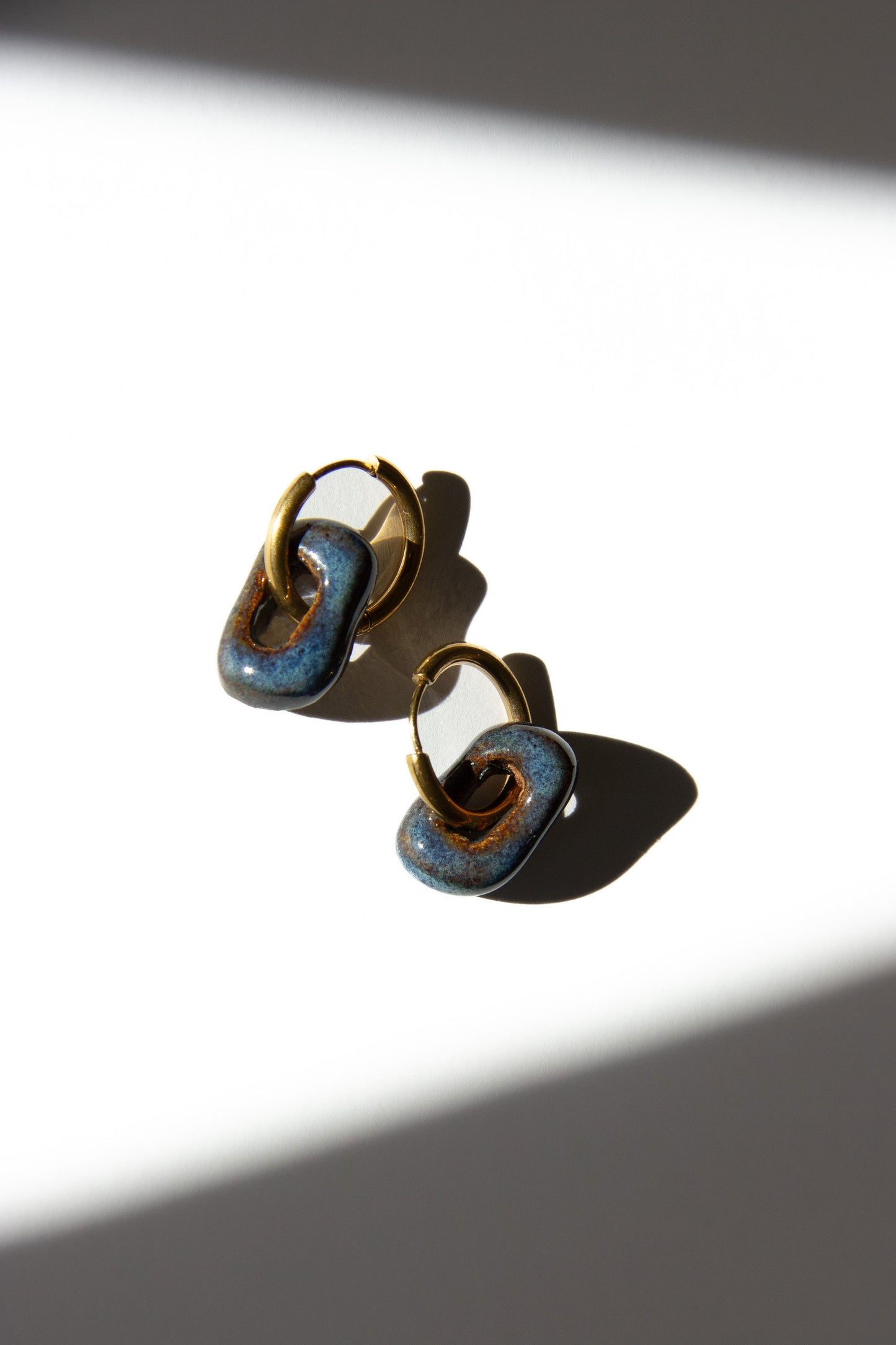 Azoia handmade ceramic earrings in Blue Jeans — subtle small hoop, everyday elegance, made in Lisbon Portugal by Jadeo Studio