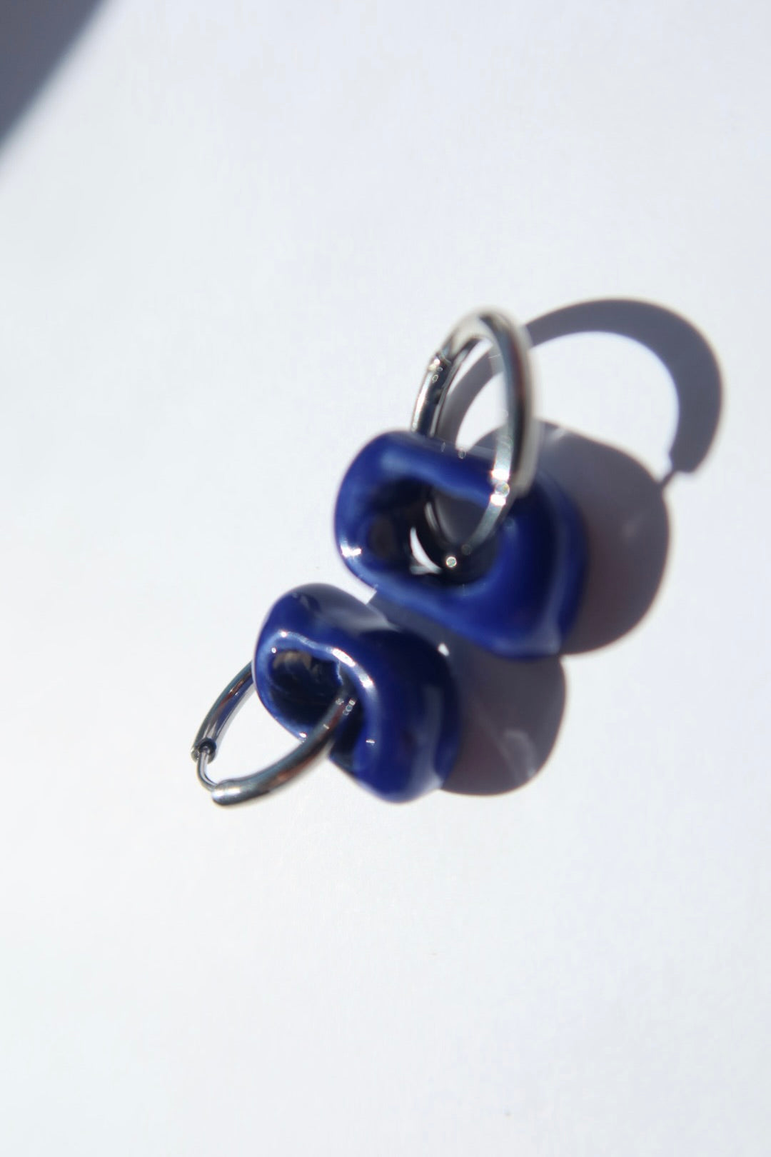 Azoia handmade ceramic earrings in Blue Navy — subtle small hoop, everyday elegance, statement jewelry made in Lisbon Portugal by Jadeo Studio