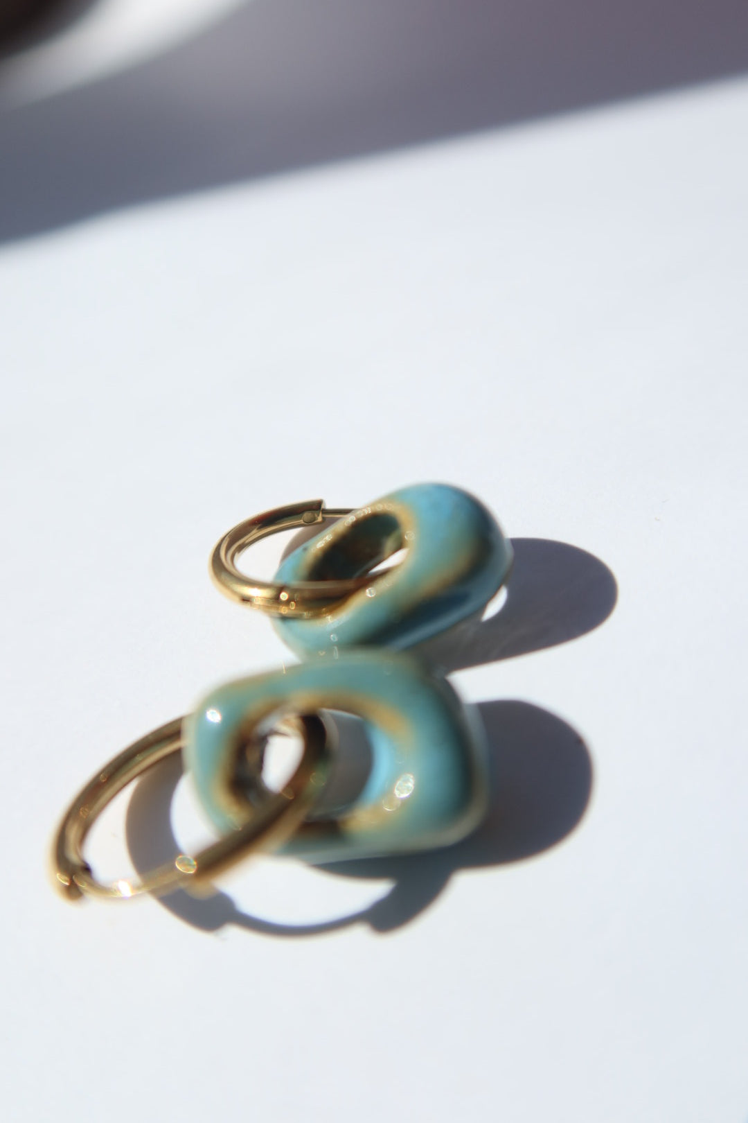 Azoia handmade ceramic earrings in Blue Sky — subtle small hoop, everyday elegance, statement jewelry made in Lisbon Portugal by Jadeo Studio