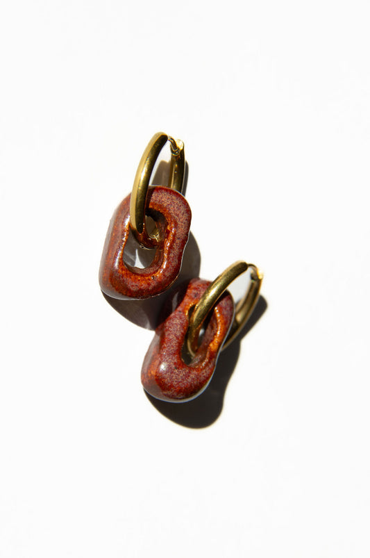 Azoia handmade ceramic earrings in Burgundy — subtle small hoop, everyday elegance, made in Lisbon Portugal by Jadeo Studio