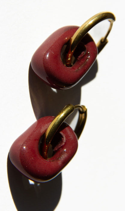 Azoia handmade ceramic earrings in Cherry, glossy glaze — subtle small hoop, everyday elegance, made in Lisbon Portugal by Jadeo Studio