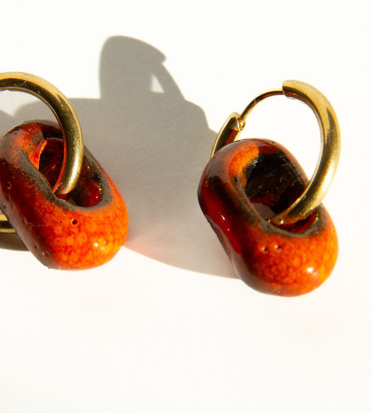 Azoia handmade ceramic earrings in Volcano on Dark Clay — subtle small hoop, everyday elegance, made in Lisbon Portugal by Jadeo Studio, lisbon lifestyle