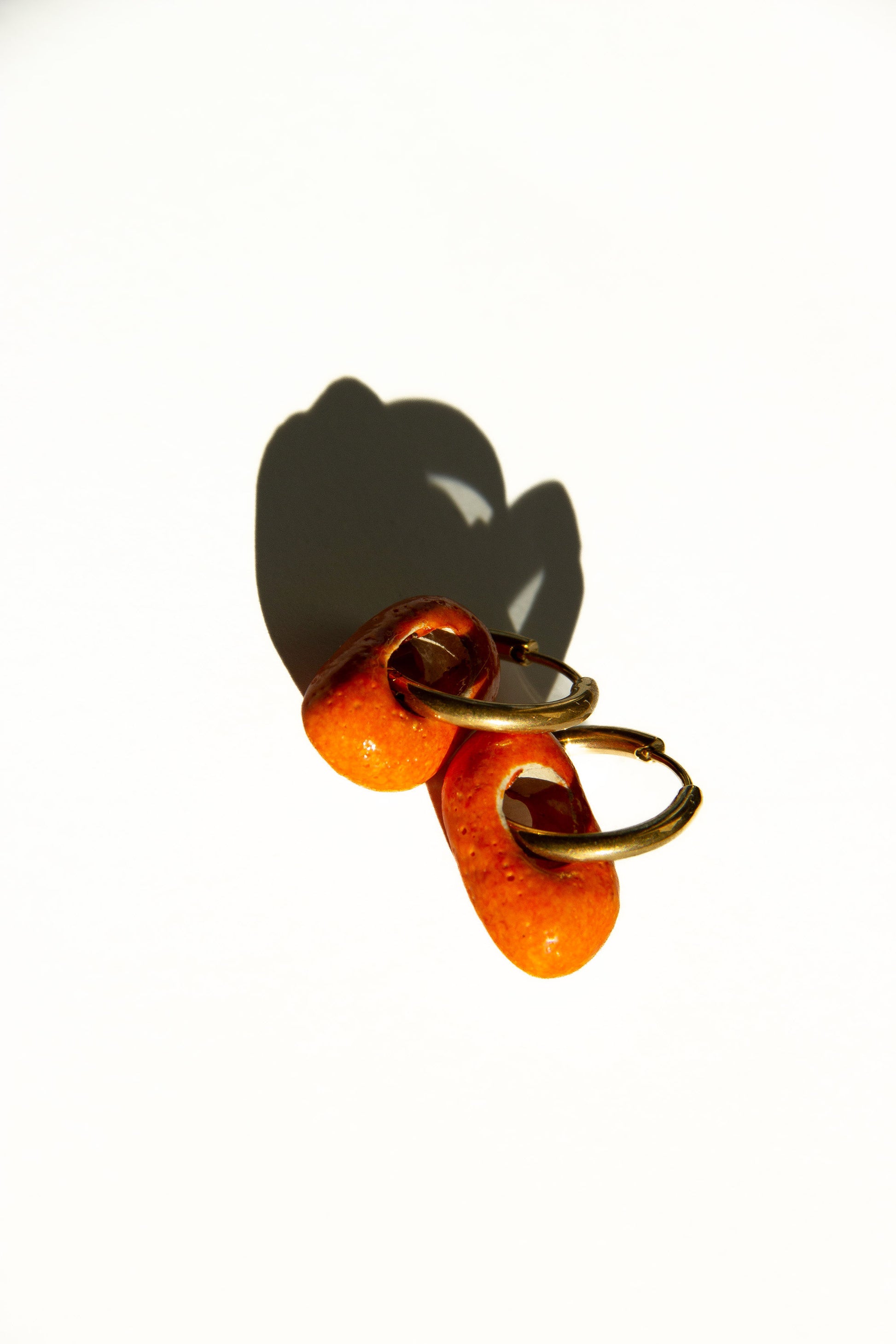 Azoia handmade ceramic earrings in Volcano — subtle small hoop, everyday elegance, made in Lisbon Portugal by Jadeo Studio
