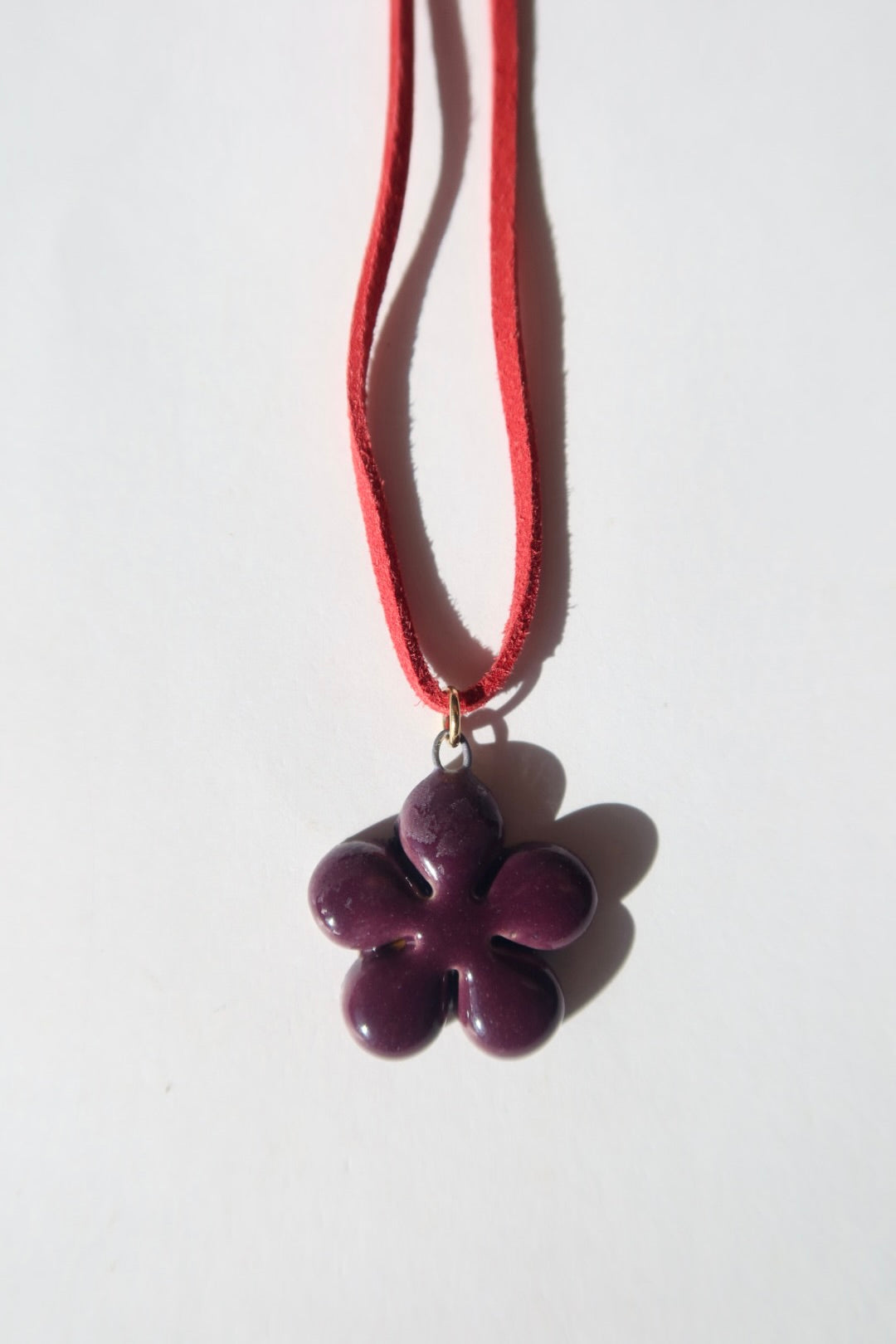 Bloom handmade ceramic flower necklace in Aubergine — inspired by Lisbon in spring, hand-sculpted, made in Portugal by Jadeo Studio