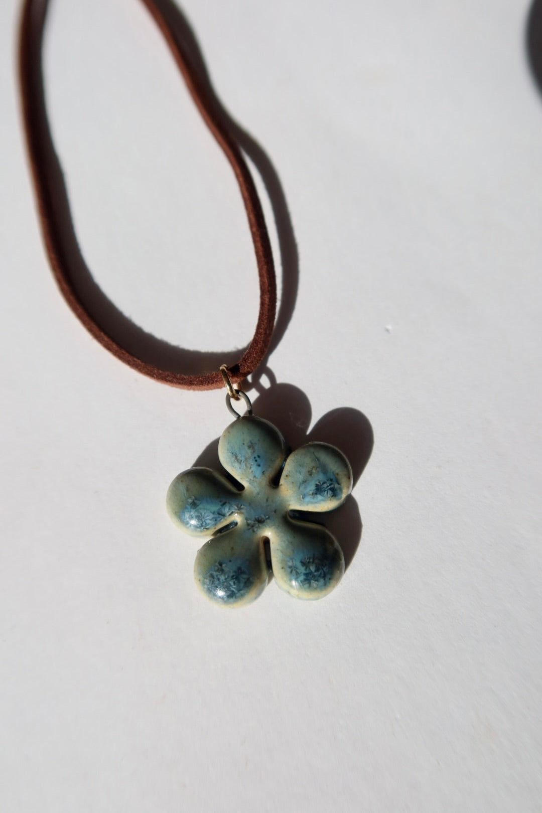 Bloom handmade ceramic flower necklace in Sparkling Blue — inspired by Lisbon in spring, hand-sculpted, made in Portugal by Jadeo Studio