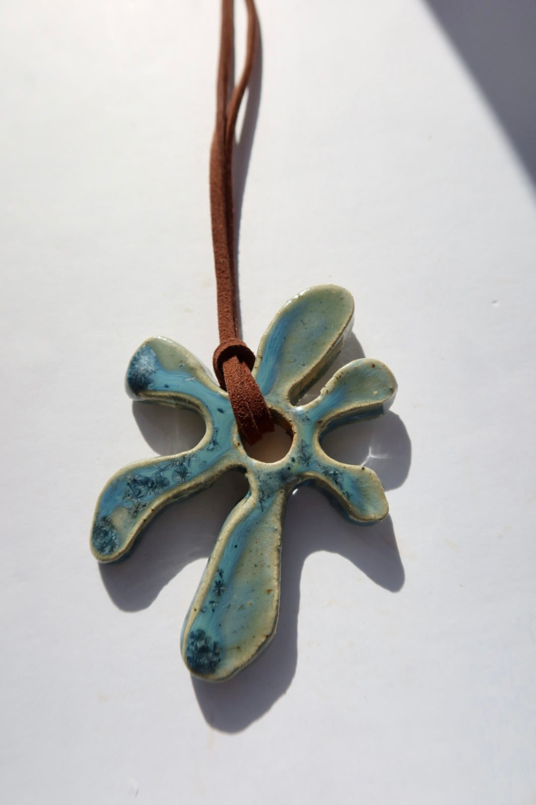 Bloom handmade ceramic flower necklace in Sparkling Blue — inspired by Lisbon in spring, hand-sculpted, made in Portugal by Jadeo Studio