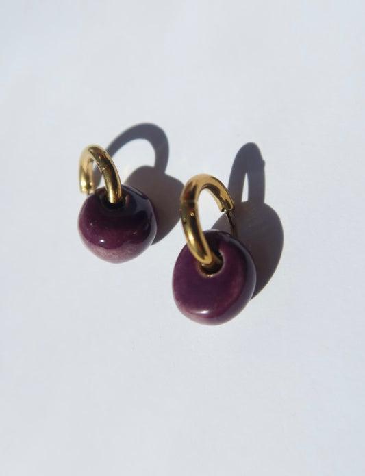 Gomes handmade ceramic earrings in Aubergine, glossy glaze — rounded circular form, bold yet discreet, made in Lisbon Portugal by Jadeo Studio