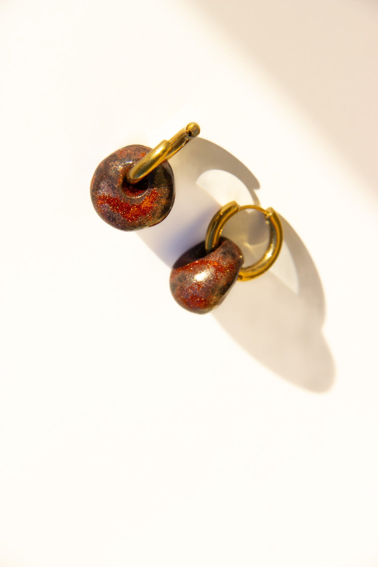 Gomes handmade ceramic earrings in Bark — rounded circular form, bold yet discreet, statement jewelry made in Lisbon Portugal by Jadeo Studio