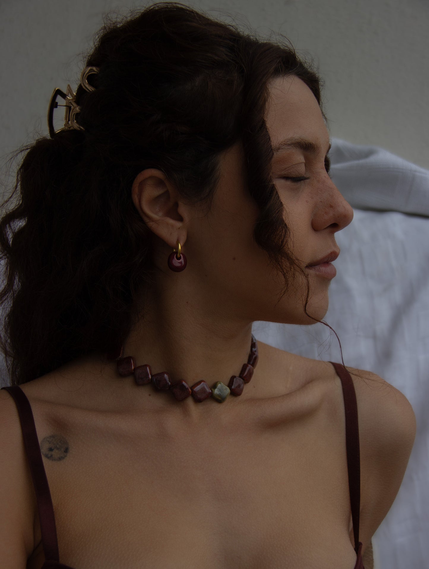 Gomes handmade ceramic earrings in Cherry — rounded circular form, bold yet discreet, statement jewelry made in Lisbon Portugal by Jadeo Studio