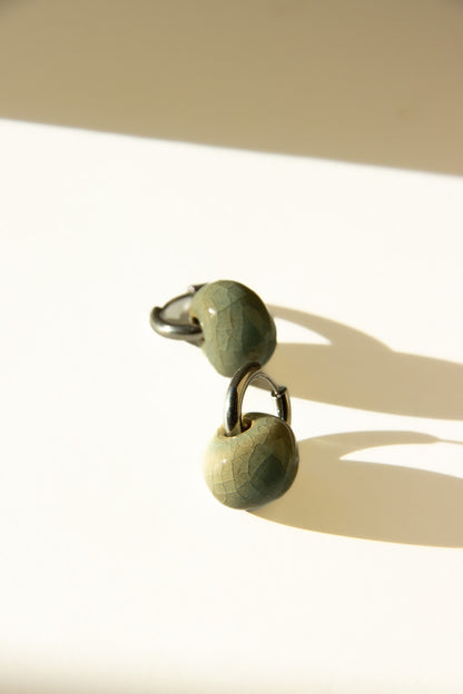 Gomes handmade ceramic earrings in Crackled Light Blue — rounded circular form, bold yet discreet, made in Lisbon Portugal by Jadeo Studio