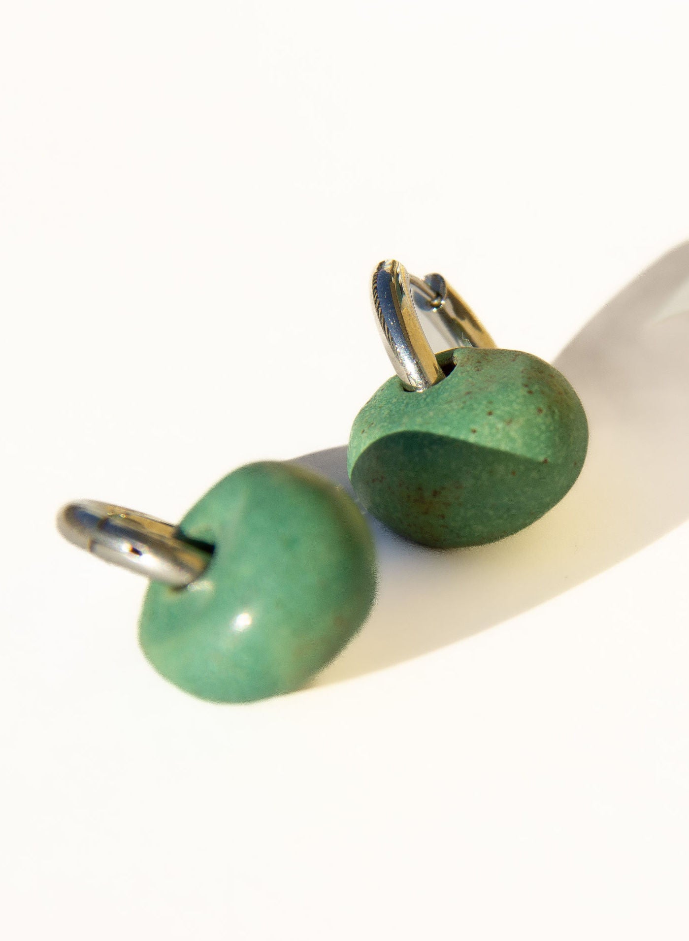 Gomes handmade ceramic earrings in Green Mat — rounded circular form, bold yet discreet, statement earrings made in Lisbon Portugal by Jadeo Studio