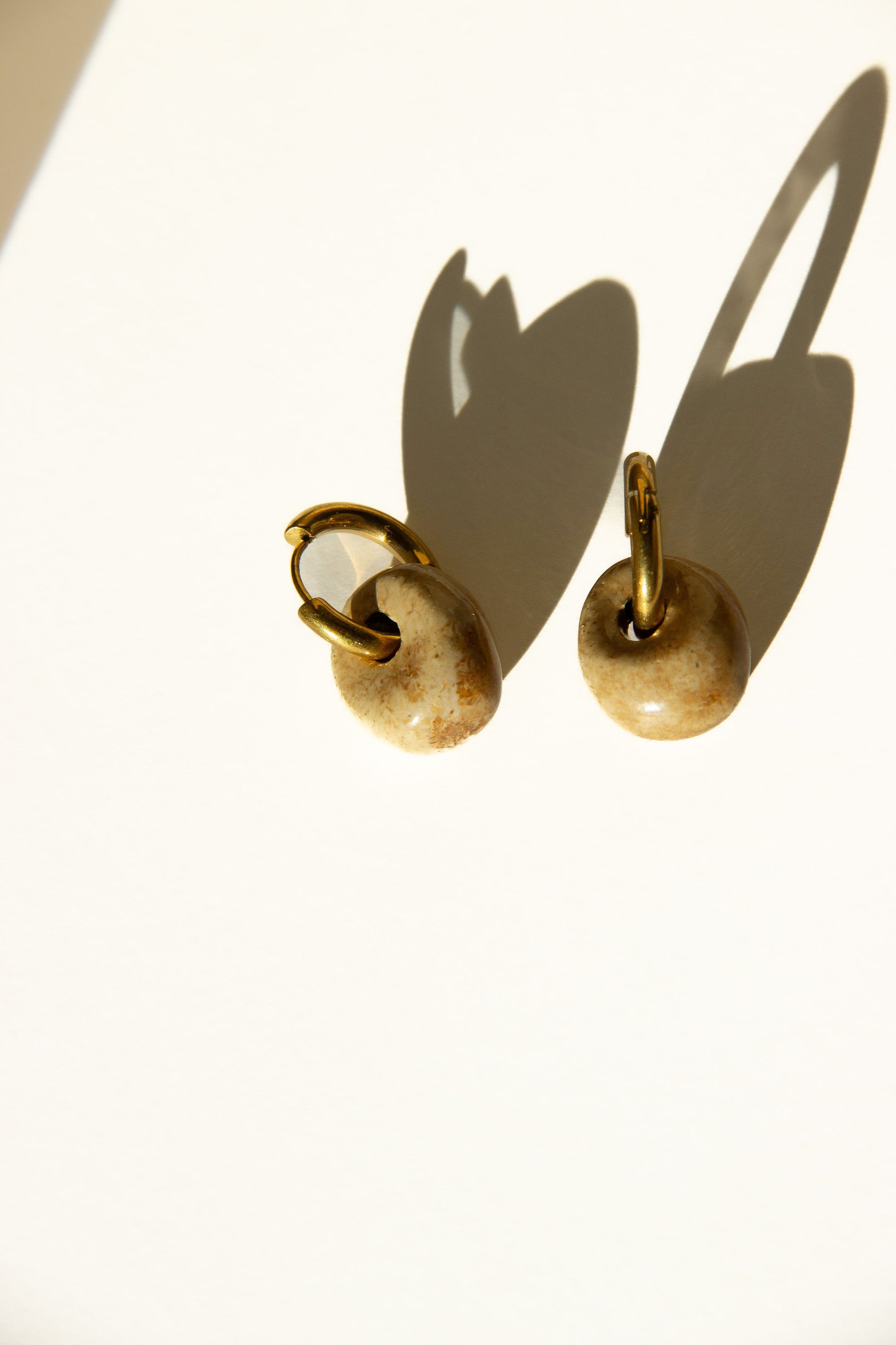 Gomes handmade ceramic earrings in Light Beige — rounded circular form, bold yet discreet, statement jewlery made in Lisbon Portugal by Jadeo Studio