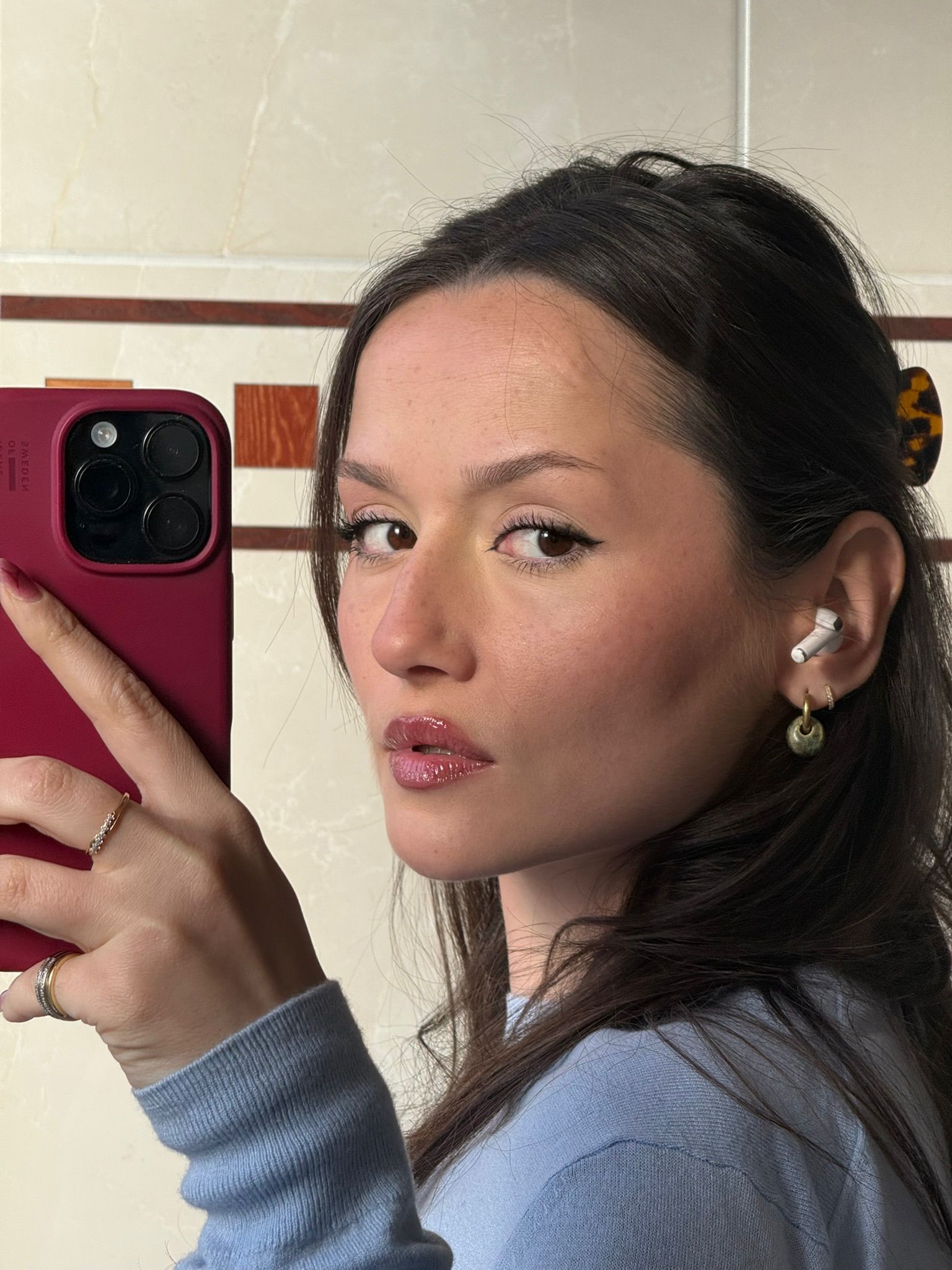 Gomes handmade ceramic earrings in Light Green -worn on lifestlye model — rounded circular form, bold yet discreet, made in Lisbon Portugal by Jadeo Studio