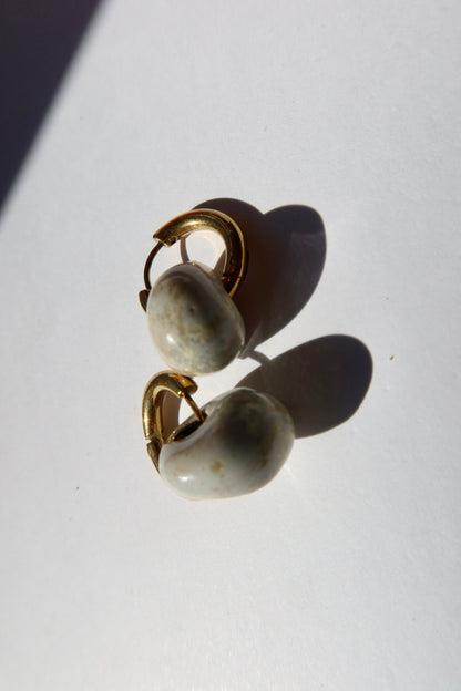 Gomes handmade ceramic earrings in Sparkling White, glossy glaze — rounded circular form, bold yet discreet, made in Lisbon Portugal by Jadeo Studio