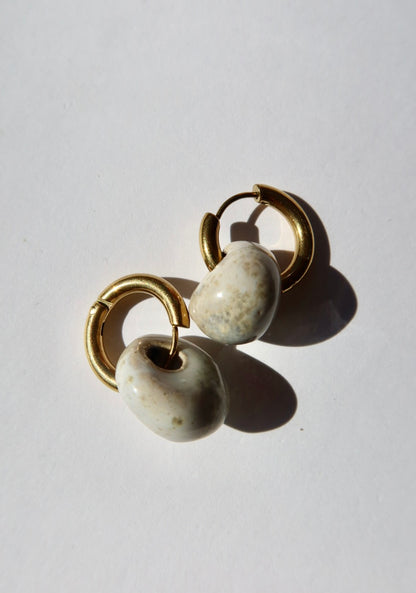 Gomes handmade ceramic earrings in Sparkling White — rounded circular form, bold yet discreet, made in Lisbon Portugal by Jadeo Studio