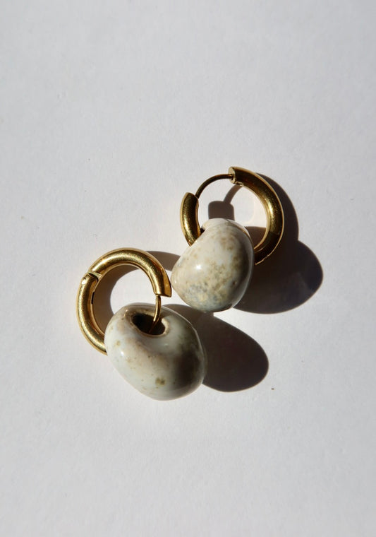 Gomes handmade ceramic earrings in Sparkling White — rounded circular form, bold yet discreet, made in Lisbon Portugal by Jadeo Studio