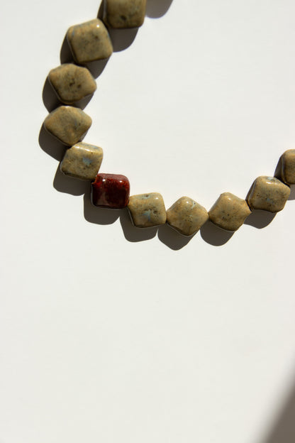Monti handmade ceramic choker necklace in Beige and Burgundy — sculptural beads inspired by Roman architecture, statement jewelry made in Lisbon Portugal by Jadeo Studio