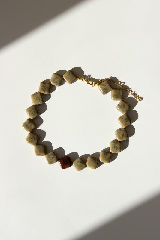 Monti handmade ceramic choker necklace in Beige and Burgundy — sculptural beads inspired by Roman architecture, made in Lisbon Portugal by Jadeo Studio