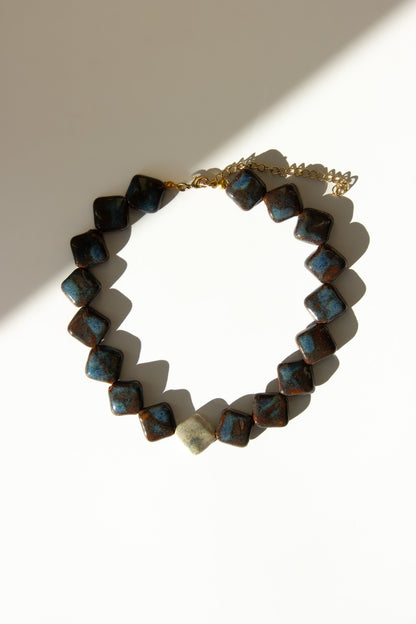 Monti handmade ceramic choker necklace in Blue Jeans and White — sculptural beads inspired by Roman architecture, made in Lisbon Portugal by Jadeo Studio, Lisbon lifestyle