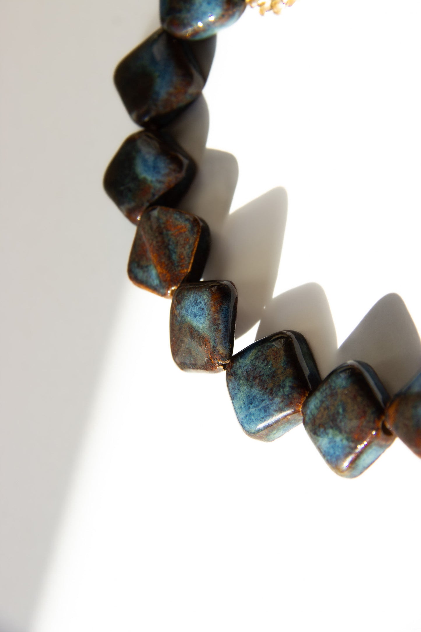 Monti handmade ceramic choker necklace in Blue Jeans and White — sculptural beads inspired by Roman architecture, made in Lisbon Portugal by Jadeo Studio, square beads
