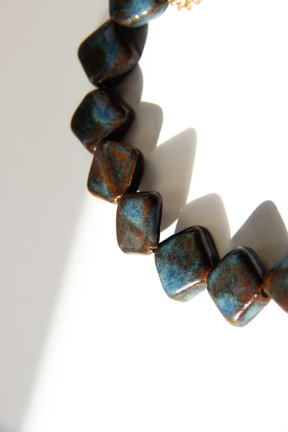Monti handmade ceramic choker necklace in Blue Jeans and White — sculptural beads inspired by Roman architecture, made in Lisbon Portugal by Jadeo Studio, square beads