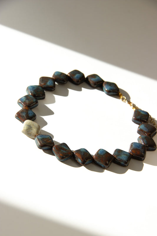 Monti handmade ceramic choker necklace in Blue Jeans and White — sculptural beads inspired by Roman architecture, made in Lisbon Portugal by Jadeo Studio