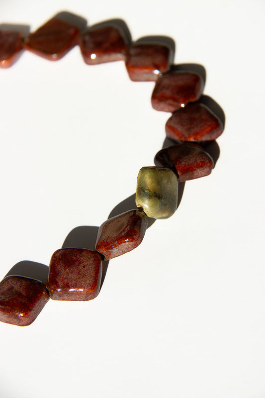 Monti handmade ceramic choker necklace in Burgundy and Light Green — sculptural beads inspired by Roman architecture, made in Lisbon Portugal by Jadeo Studio