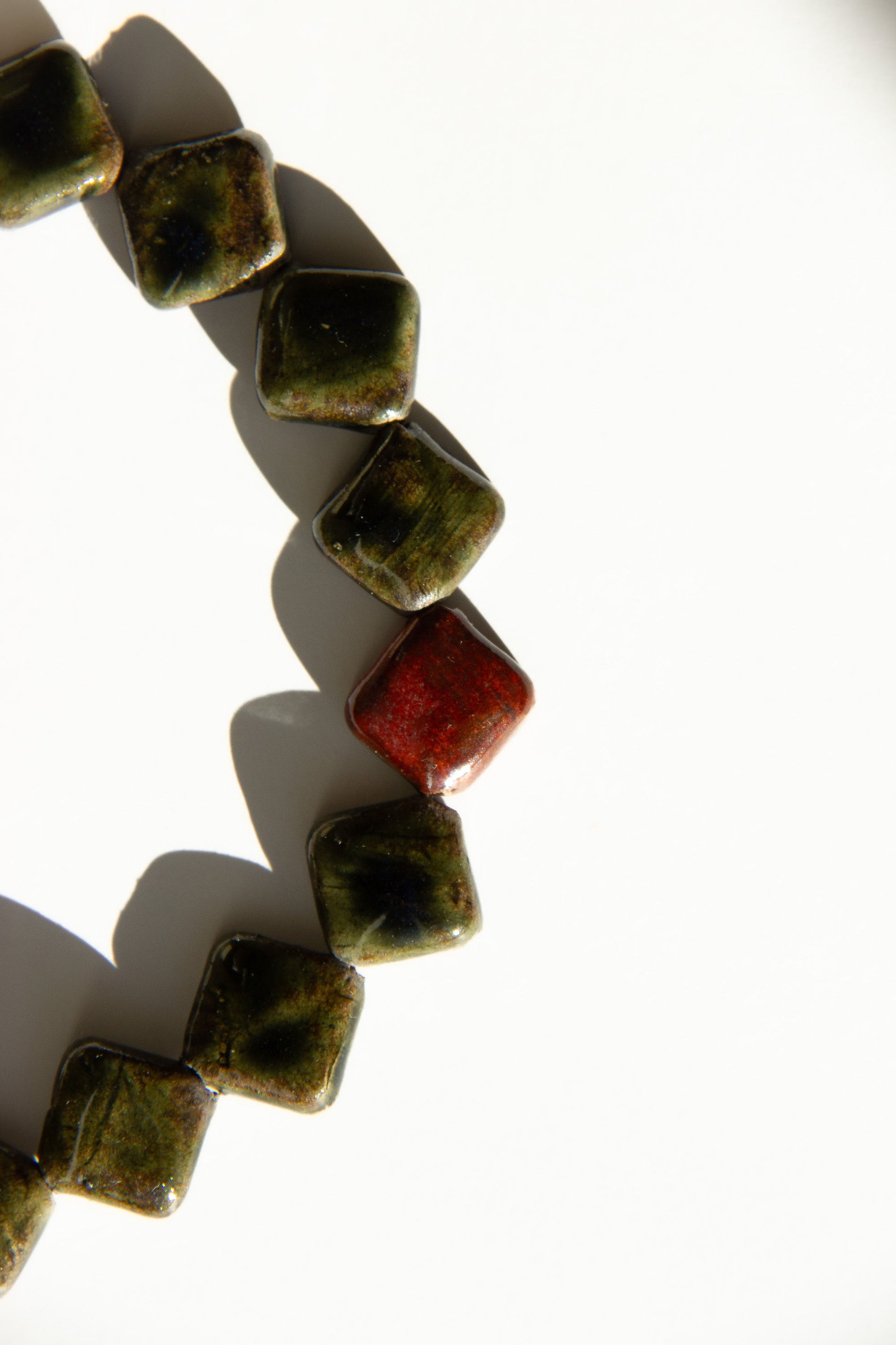 Monti handmade ceramic choker necklace in Dark Green and Burgundy — sculptural beads inspired by Roman architecture, made in Lisbon Portugal by Jadeo Studio, square beads