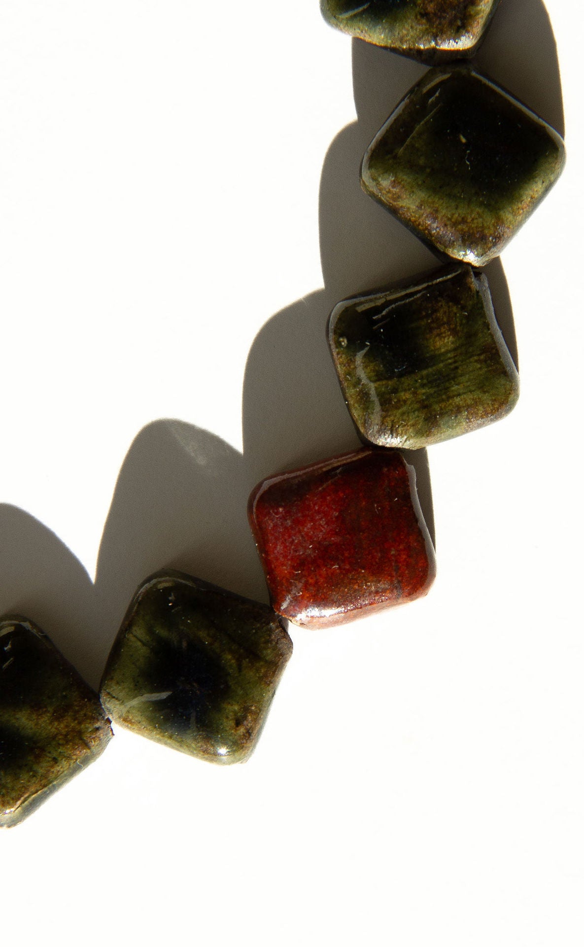 Monti handmade ceramic choker necklace in Dark Green and Burgundy, statement jewelry — sculptural beads inspired by Roman architecture, made in Lisbon Portugal by Jadeo Studio