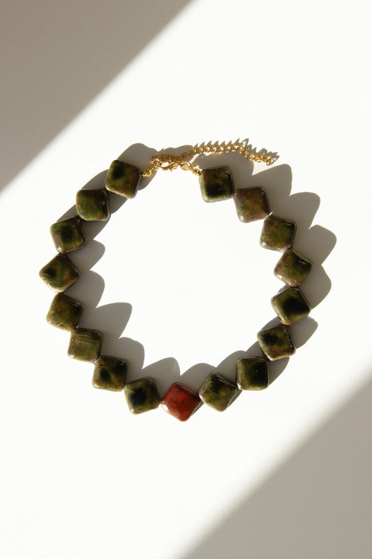 Monti handmade ceramic choker necklace in Dark Green and Burgundy — sculptural beads inspired by Roman architecture, made in Lisbon Portugal by Jadeo Studio