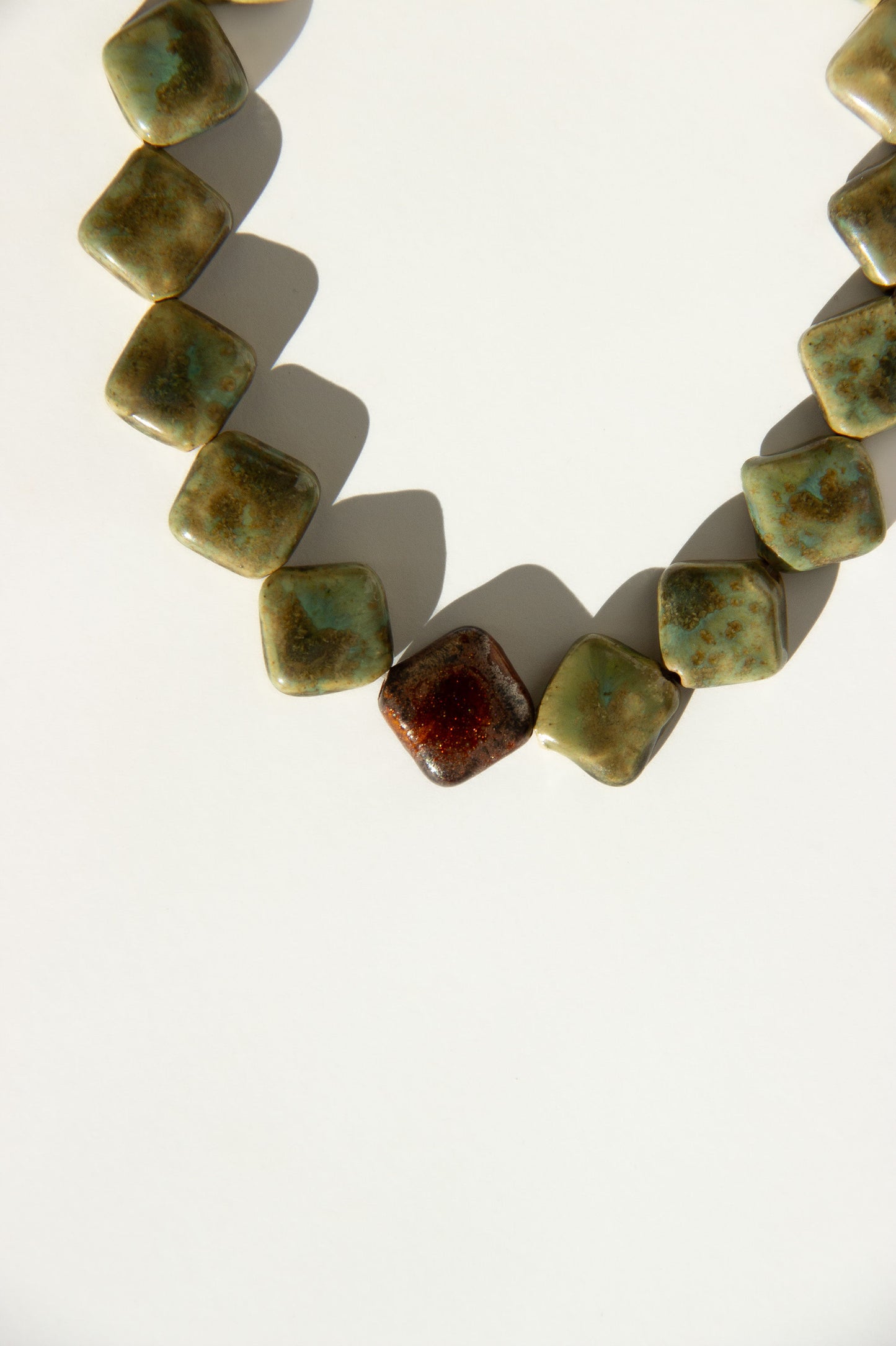 Monti handmade ceramic choker necklace in Light Green and Bark — sculptural beads inspired by Roman architecture, made in Lisbon Portugal by Jadeo Studio