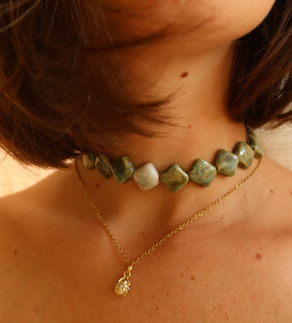 Monti handmade ceramic choker necklace in Light Green and Sparkling White worn with model with short hair — sculptural beads inspired by Roman architecture, made in Lisbon Portugal by Jadeo Studio