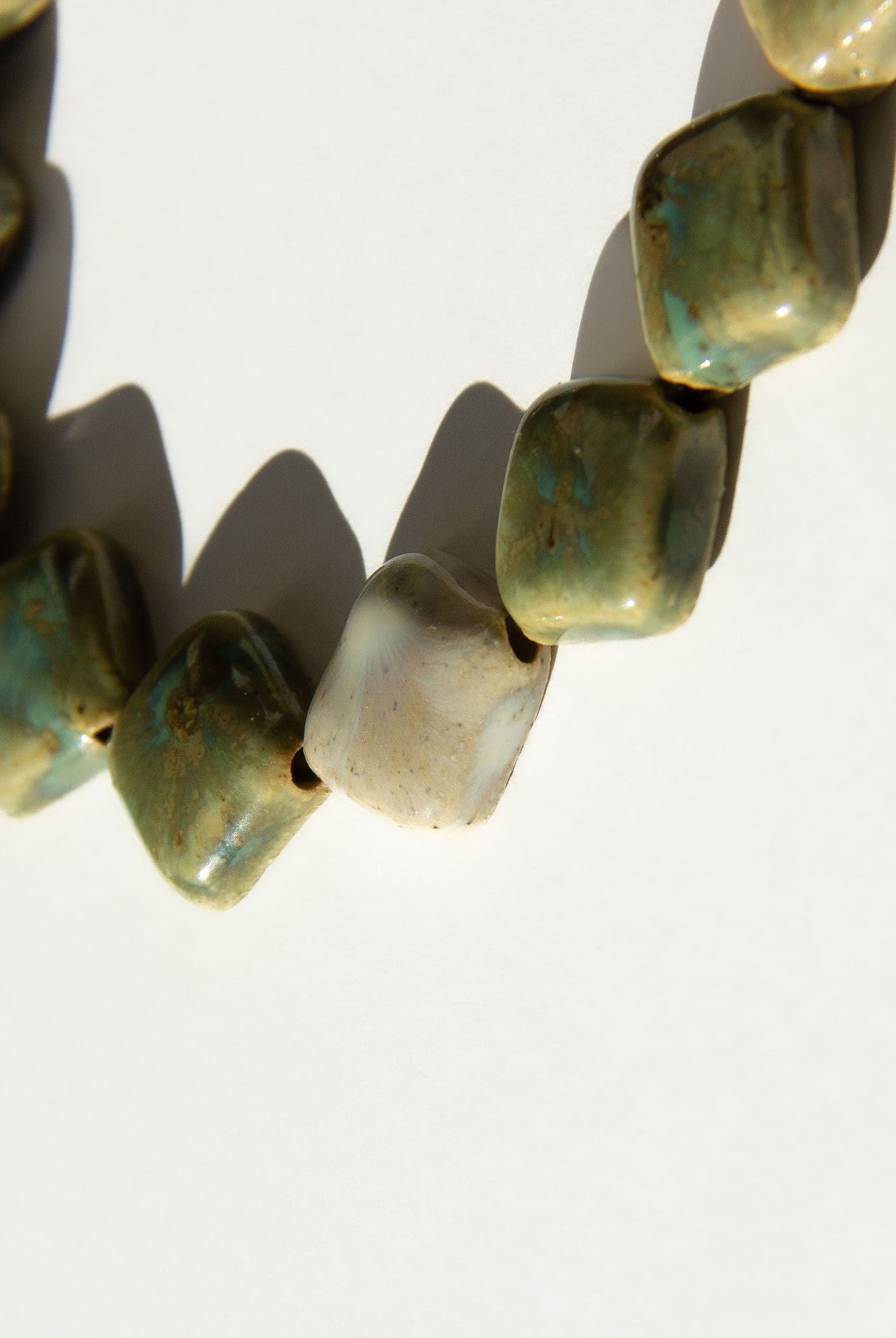 Monti handmade ceramic choker necklace in Light Green and Sparkling White, glossy glaze — sculptural beads inspired by Roman architecture, made in Lisbon Portugal by Jadeo Studio