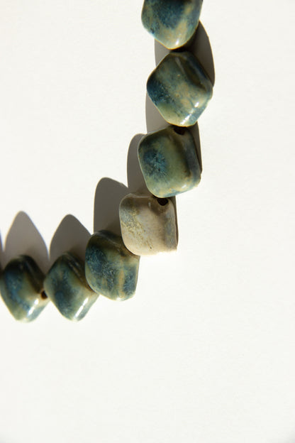 Monti handmade ceramic choker necklace in Sparkling Blue and White, glossy glaze— sculptural beads inspired by Roman architecture, made in Lisbon Portugal by Jadeo Studio