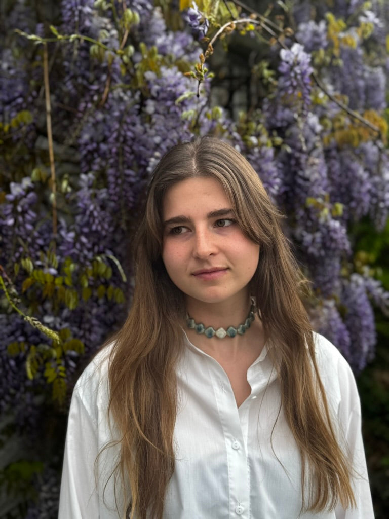 Monti handmade ceramic choker necklace in Sparkling Blue and White — sculptural beads inspired by Roman architecture, made in Lisbon Portugal by Jadeo Studio, worn on model long hair