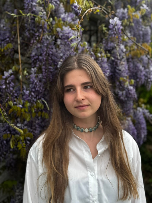 Monti handmade ceramic choker necklace in Sparkling Blue and White — sculptural beads inspired by Roman architecture, made in Lisbon Portugal by Jadeo Studio, worn on model long hair