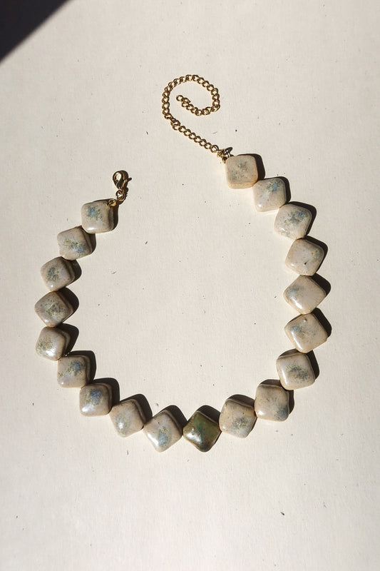 Monti handmade ceramic choker necklace in Sparkling White and Light Green — sculptural beads inspired by Roman architecture, made in Lisbon Portugal by Jadeo Studio