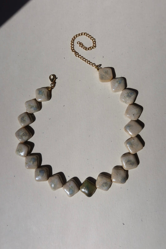 Monti handmade ceramic choker necklace in Sparkling White and Light Green — sculptural beads inspired by Roman architecture, made in Lisbon Portugal by Jadeo Studio